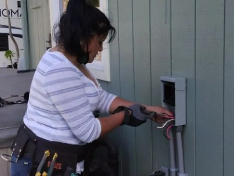 Licensed electrician wiring an exterior subpanel in Jefferson